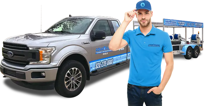 An Aqua Clean technician standing in front of a company truck ready to provide residential and commercial pressure washing and soft washing services in Appleton, Wisconsin.