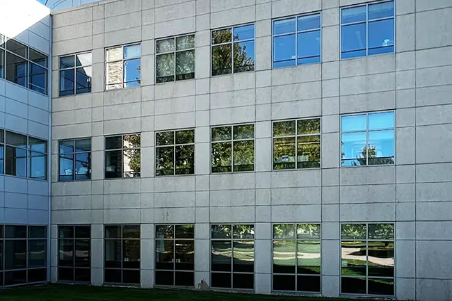 The same commercial building exterior looking clean and restored after a professional building facade soft washing service service in Neenah, Wisconsin.