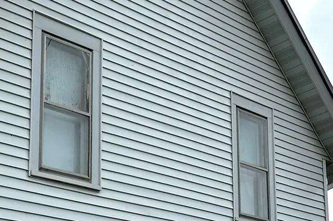 The same residential vinyl home siding looking completely clean after a professional house soft wash service in Appleton, Wisconsin.